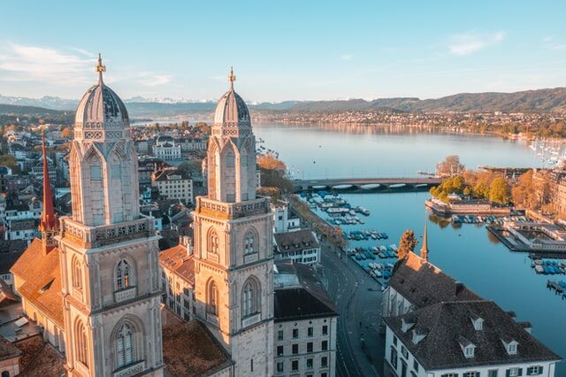 A vibrant illustration depicting the diverse cultural landscapes of Swiss wealth management, highlighting the unique characteristics of French-speaking, German-speaking, and Italian-speaking cantons, and the challenges of linguistic diversity in business. Navigating