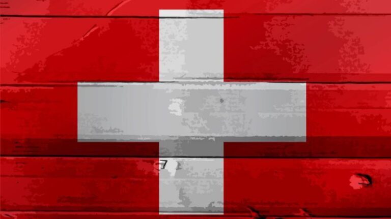 Swiss flag waving in front of the majestic Swiss Alps, celebrating Switzerland's National Day on August 1st, 2024.