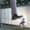 A giant businessman’s foot stepping on a smaller professional, symbolising challenges faced during career transitions in banking.