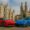 Red Ferrari in front of Milan Cathedral and blue Porsche in front of Zurich’s Grossmünster symbolising wealth and mindset