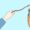 Illustration of a hand holding a carrot on a stick, symbolising RM motivation in private banking leadership