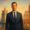 A well-dressed advisor stands confidently against iconic backdrops of Dubai, Lisbon, and Barcelona – ideal for private banking