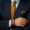 Close-up of a luxury bracelet worn with a tailored suit, symbolising personal identity in wealth management