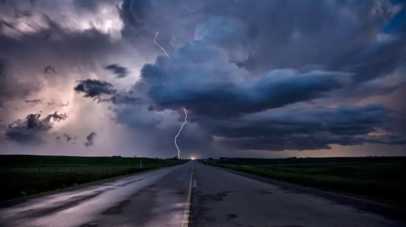 A stormy road with lightning symbolising disruption in Swiss private banking and the need to reshape the future