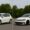 Two similar white hatchback cars side by side: one standard, one customised — visual metaphor for scalable vs. tailored setups