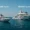 Side by side yachts showing the lifestyle difference between a High Net Worth Individual (HNWI) and an Ultra High Net Worth Individual (UHNWI)