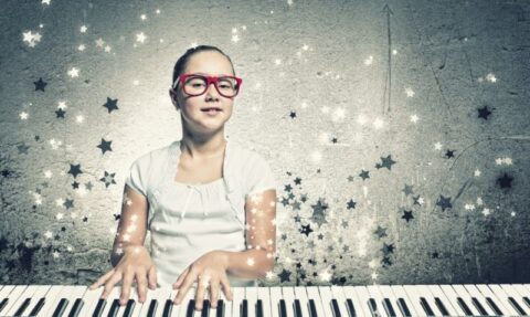 Young girl playing a piano with star effects, symbolising learning multiple skills and mastering the full spectrum of wealth management.