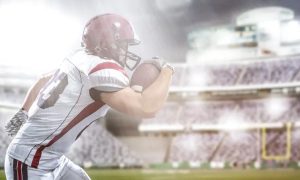 A football player running with the ball, symbolizing independent wealth managers using an open platform advantage to tailor financial solutions.